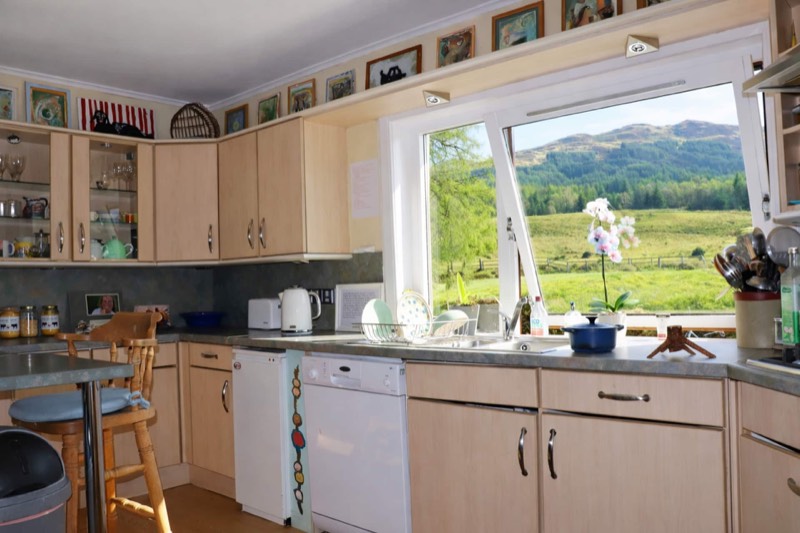 The guest kitchen, with the glen framed in the window above the sink