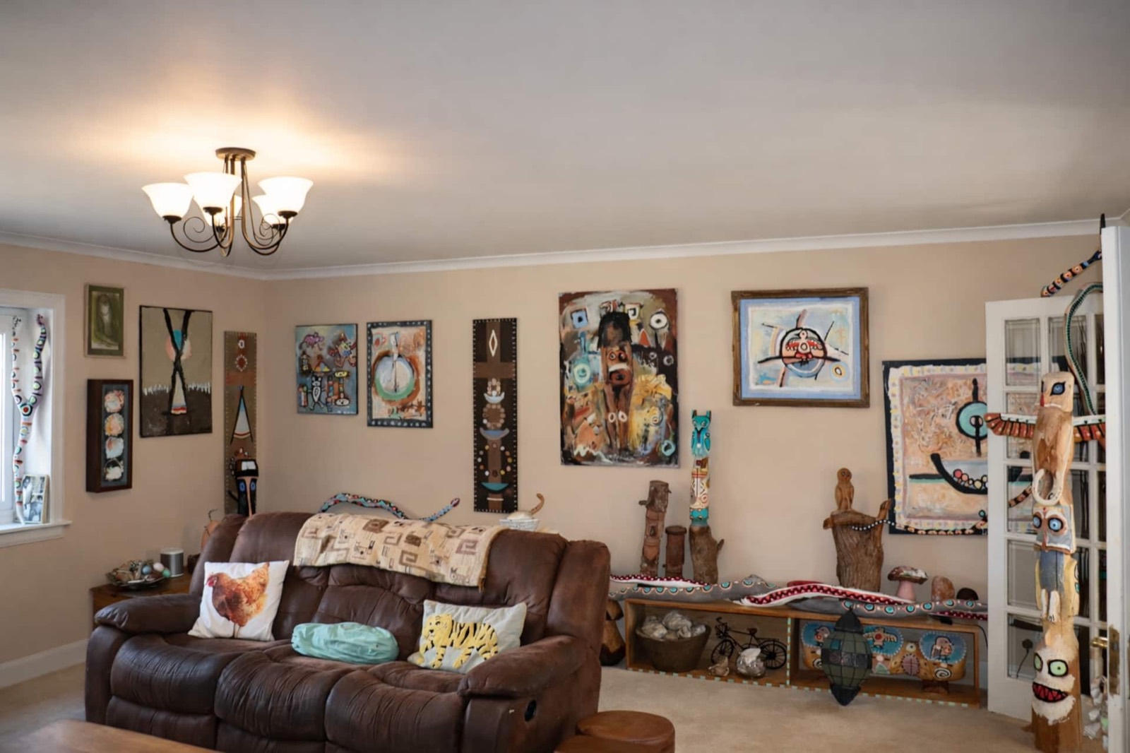 The living room, hung with the artist's own work