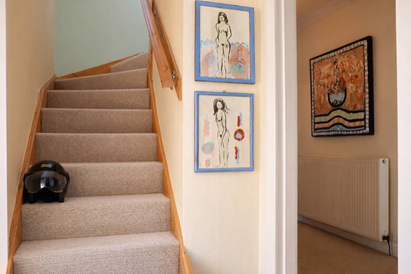 The staircase up to the family suite, artwork all the way