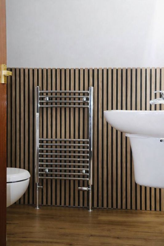 A wood-and-slate bathroom with underfloor-warm rail