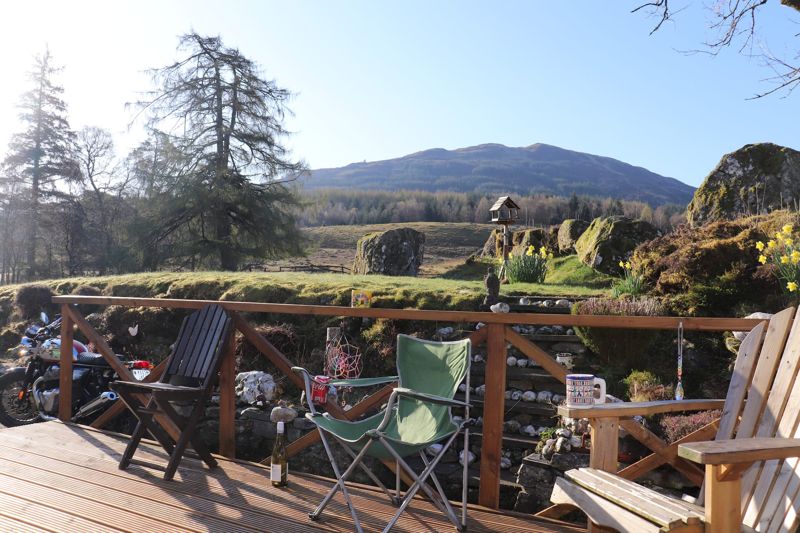 The decking, laid out for coffee with a mountain view