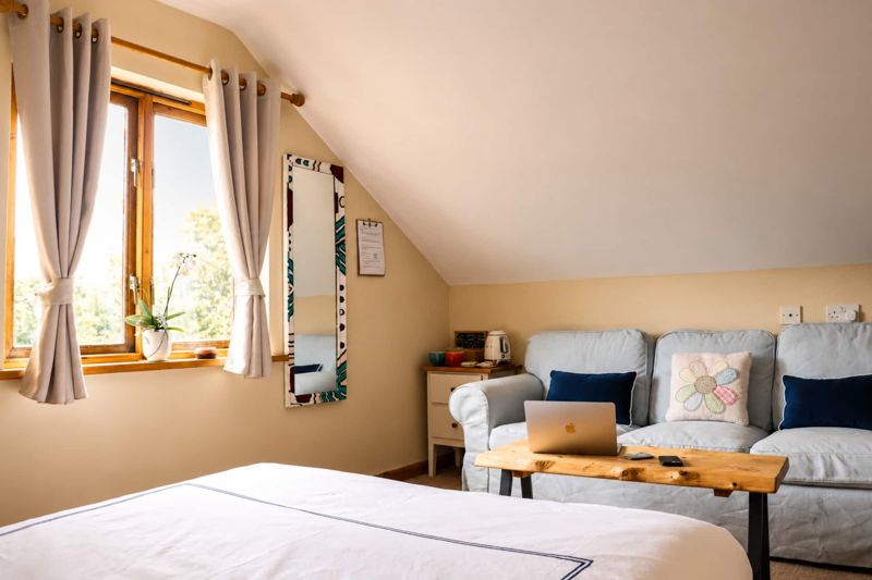The family suite's sitting area, king bed alongside